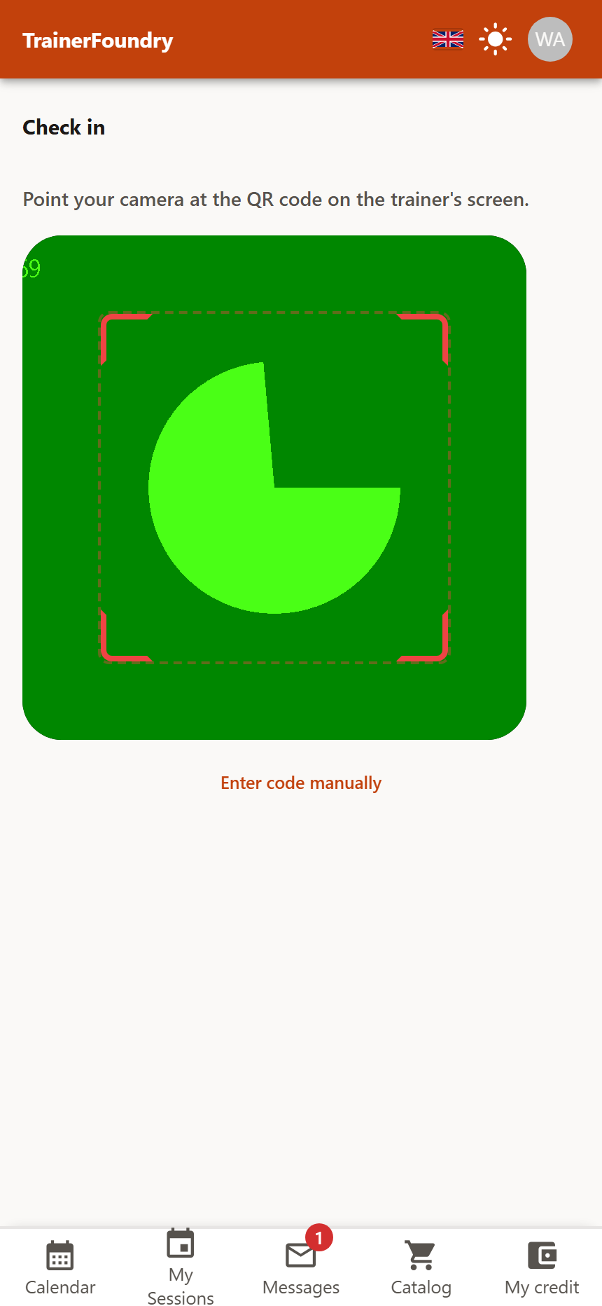 The check-in screen with the instruction “Point your camera at the QR code on the trainer's screen”, the viewfinder frame and the “Enter code manually” link.