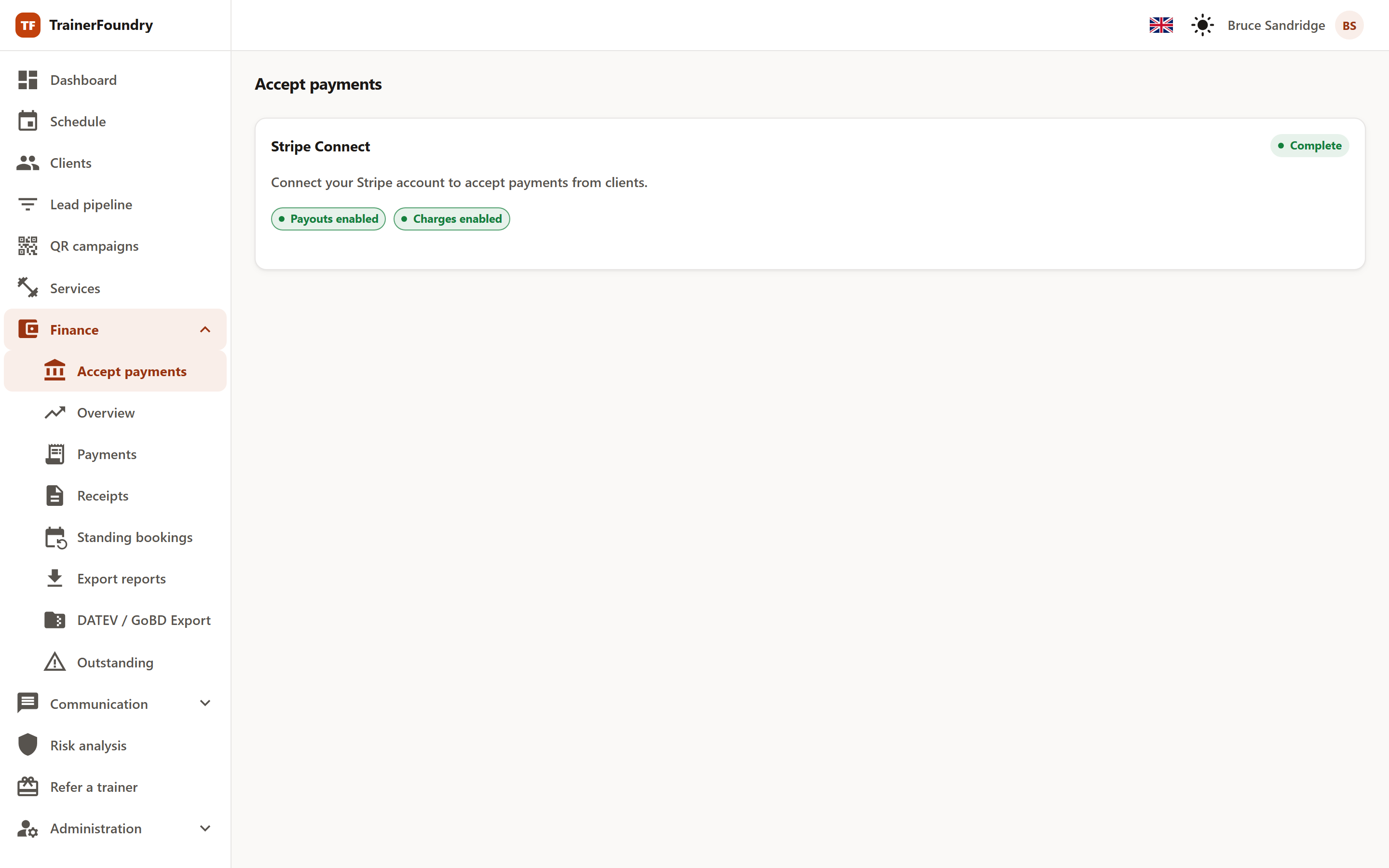 The 'Accept payments' page with the Stripe Connect card, the status badge, and the badges for enabled payouts and charges.